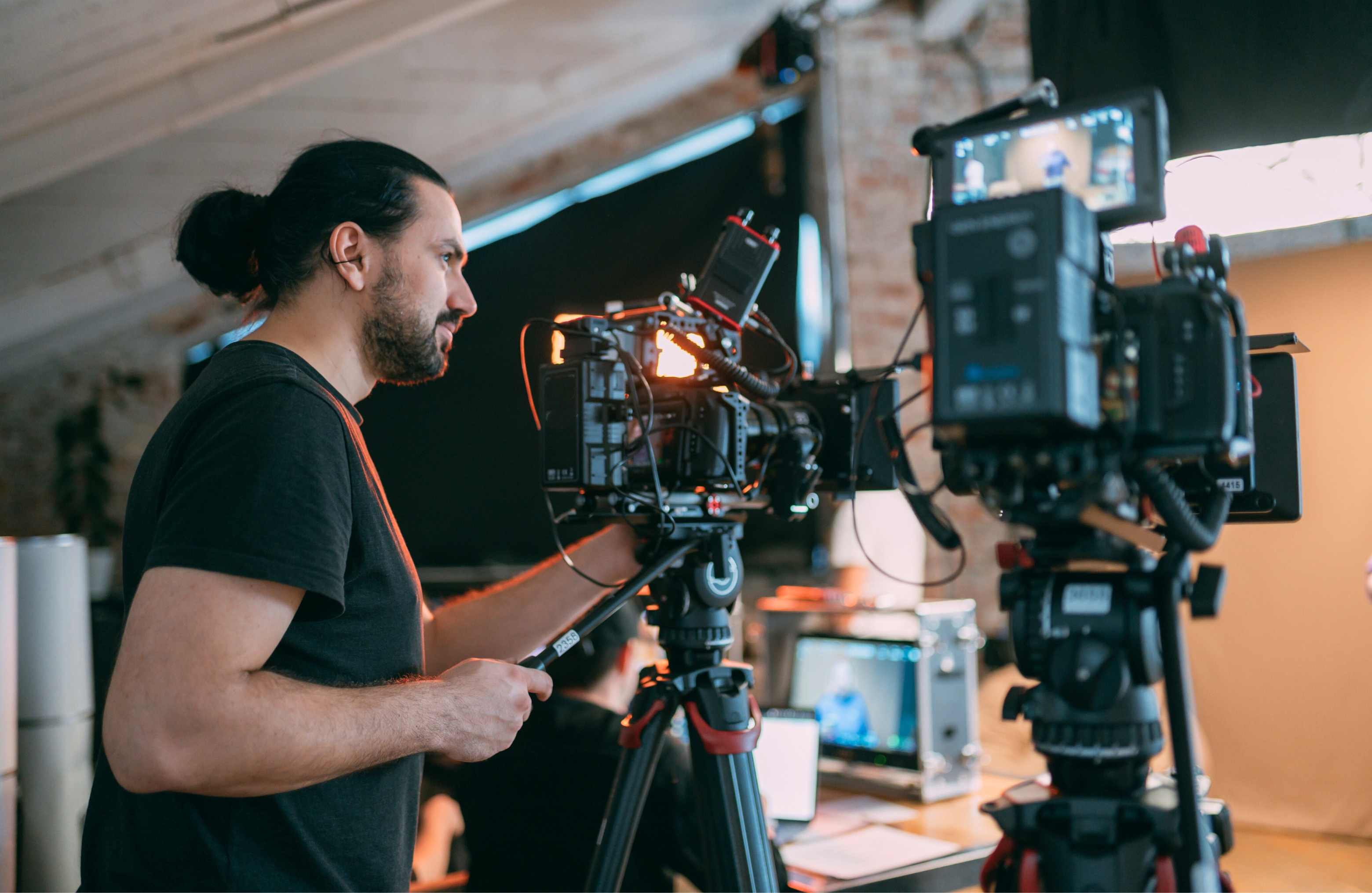 Professional videographer at work on filming a movie 